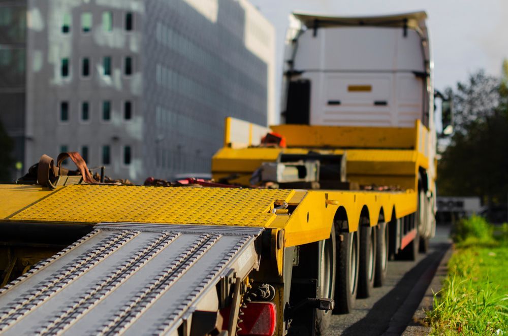 Yellow Flatbed Truck on Road — Compass Equipment Hire in Brunswick Heads, NSW