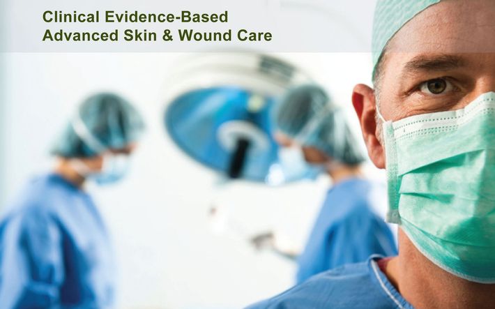 Medical professionals in scrubs and masks stand in an operating room with text reading