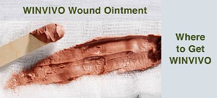 Wound ointment applied on fabric, with a wooden applicator. Text: