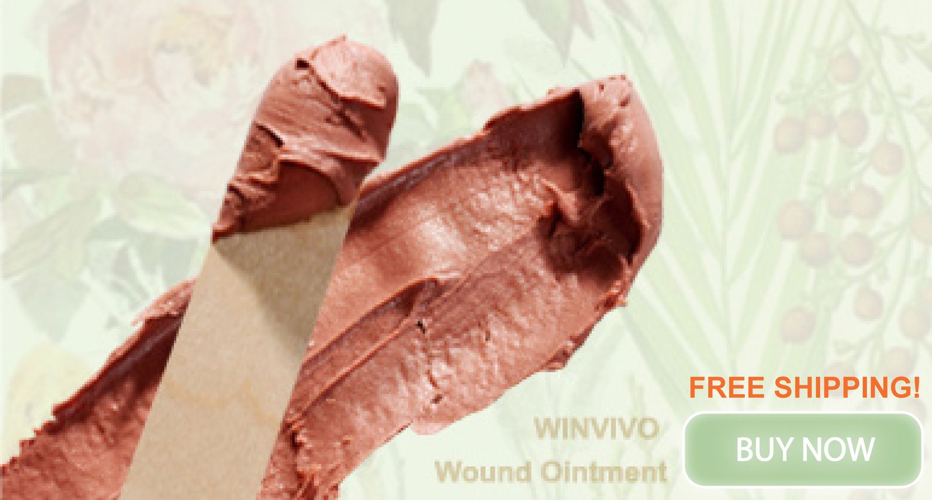 Wooden spatulas with brown wound ointment against a floral background.
