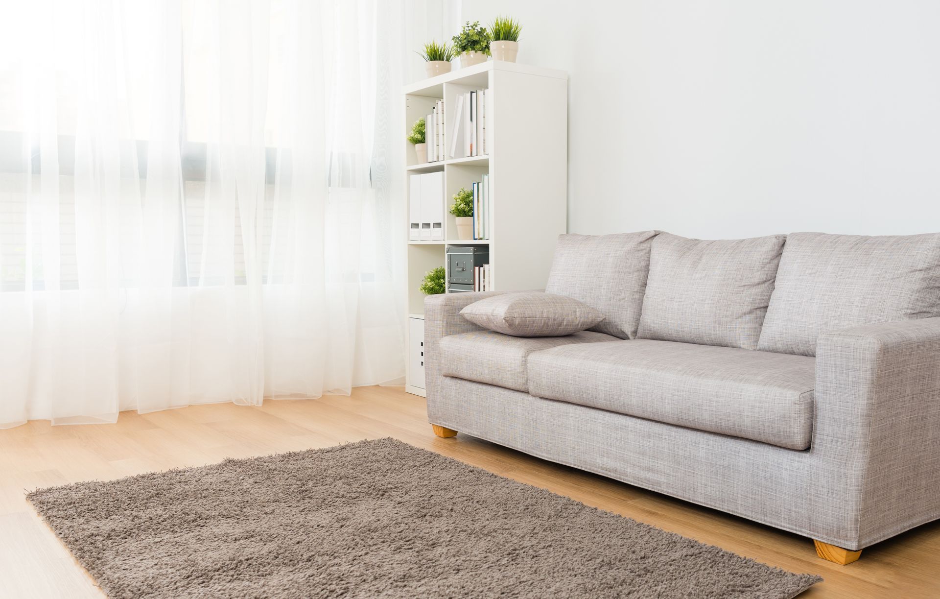 there is a couch and a rug in the living room