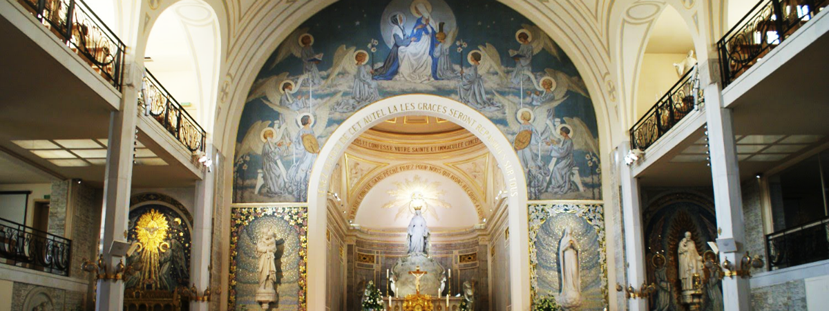 Interior of a church with an altar and a large painting on the ceiling.