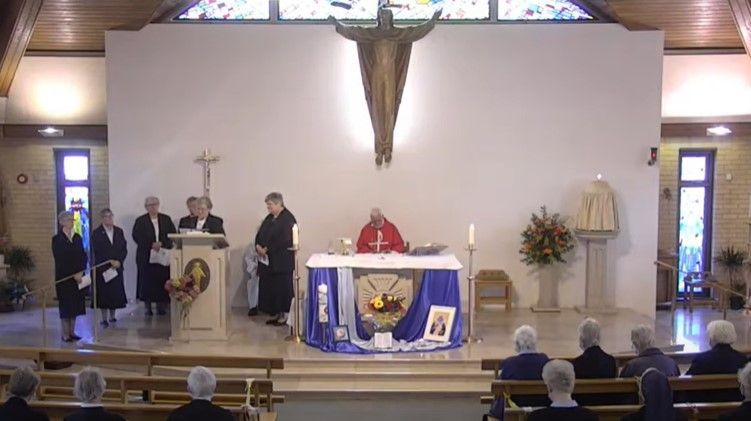 A group of people are standing around an altar in a church.