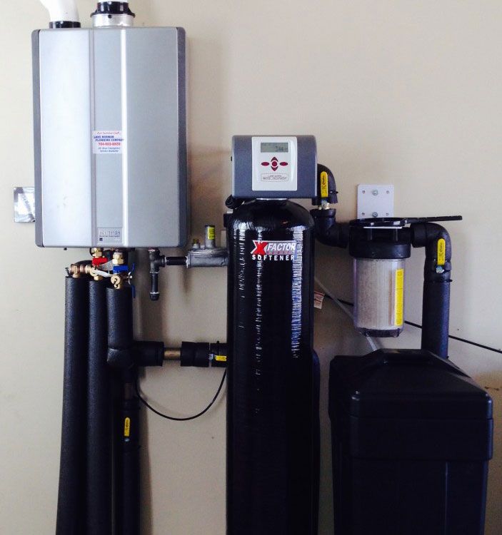 Wall-mounted water heater and home water treatment system with tanks and filters in a utility room
