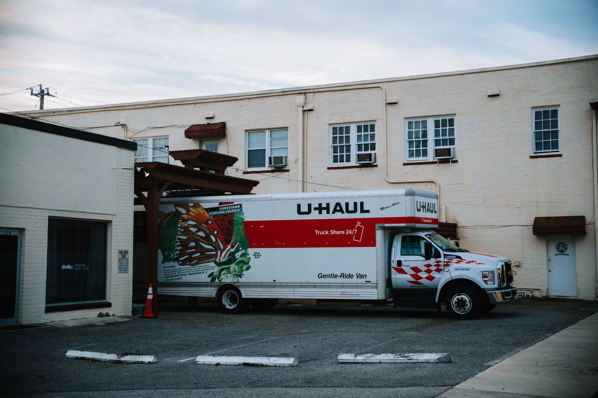 A large U-Haul truck rental vehicle parked outside.