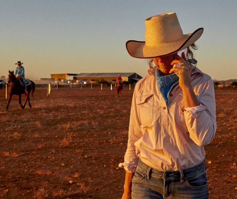 Lady On Mobile Phone In Outback — Frontier Connect in Newtown, QLD