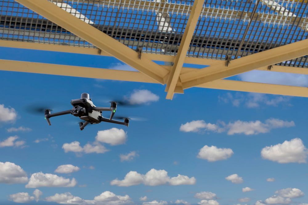 A Drone is Flying in the Sky Under a Roof — Frontier Connect in Newtown, QLD