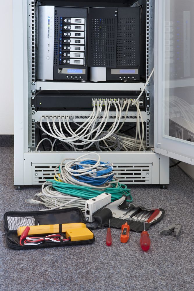 A Server Rack With a Bunch of Wires and Tools on the Floor — Frontier Connect in Warwick, QLD