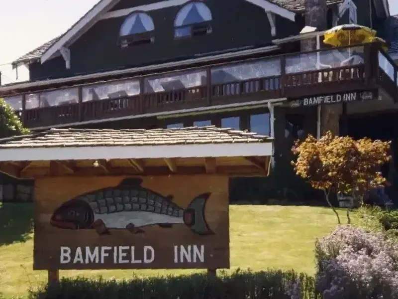 A sign for bamfield inn with a fish on it