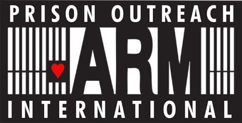 Black and white Prison Outreach International logo with red heart and prison bars forming the “I” in “Prison”