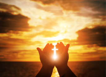 Volunteer to Serve! Silhouetted hands cupping the sun at a golden sunset