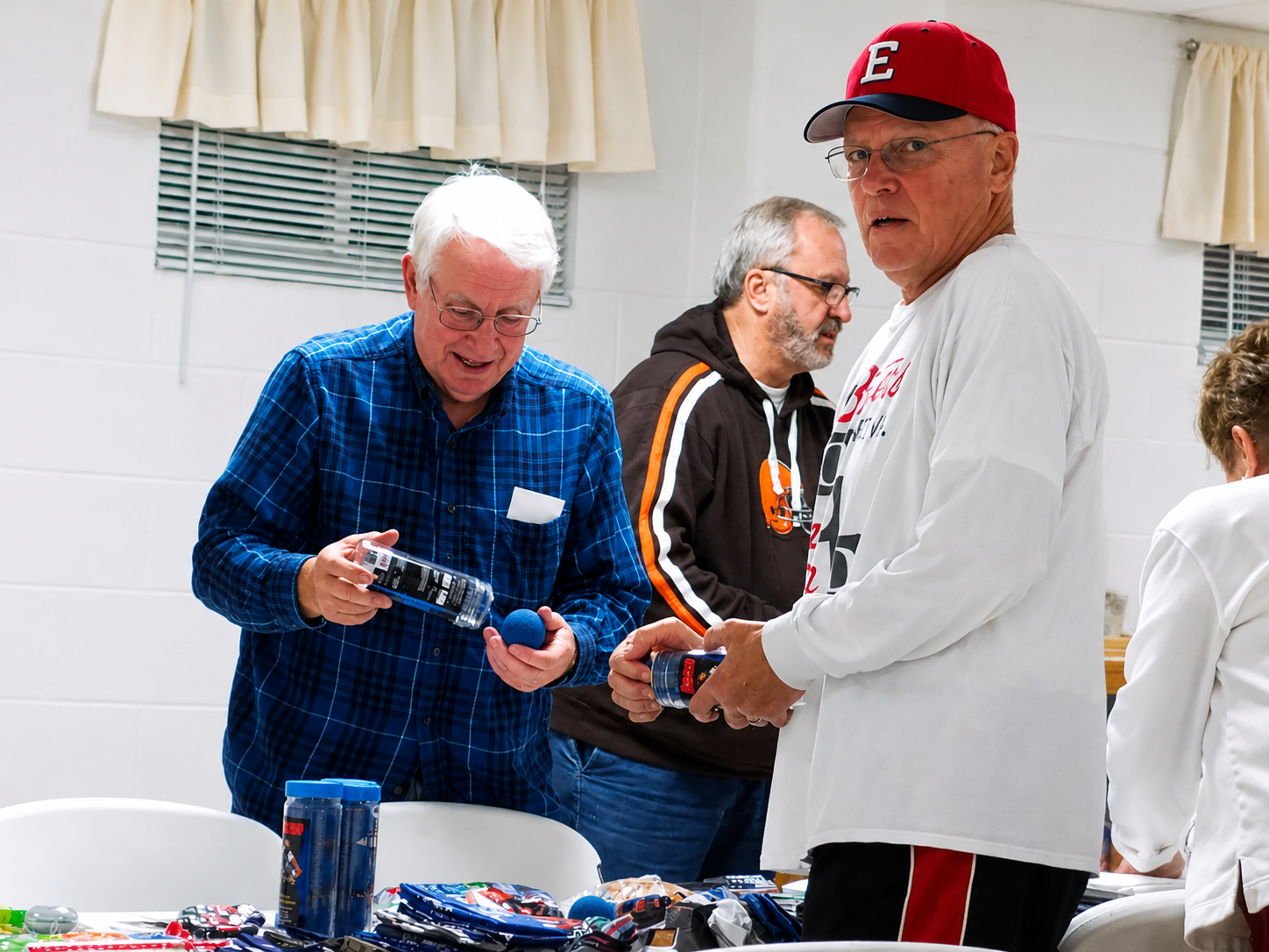 More About the MIssions We Support People serving non-alcoholic drinks at a table to serve to people in need.