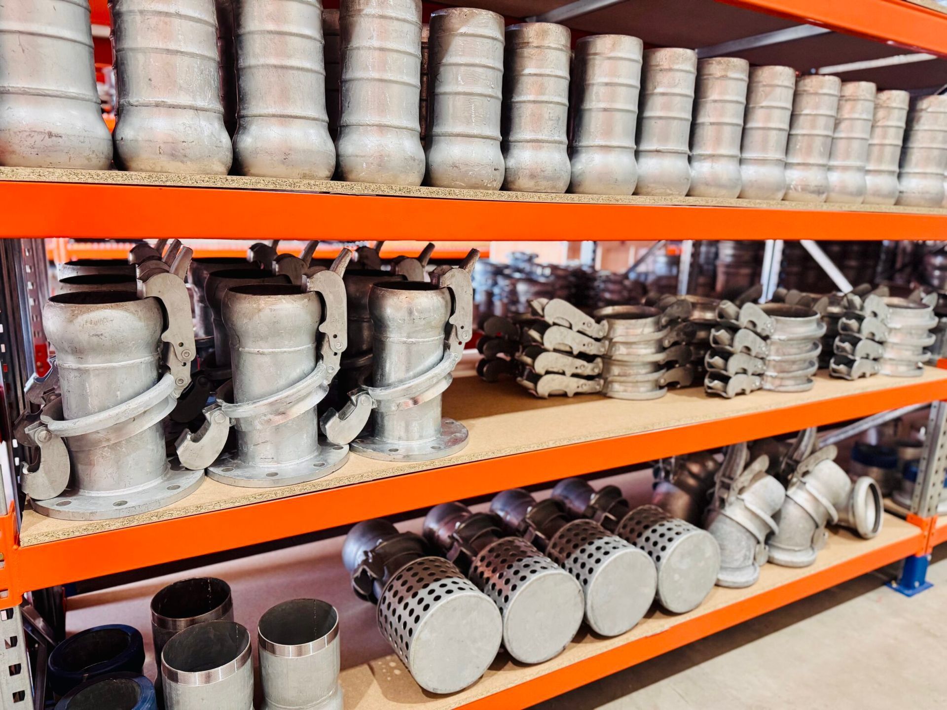 Shelves Of Stacked Industrial Metal Pipes and Fittings — Forcequip In Moranbah, QLD