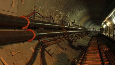 Tunnel With Pipes, Cables, and a Narrow Walkway Along the Side — Forcequip Hire In Mackay, QLD