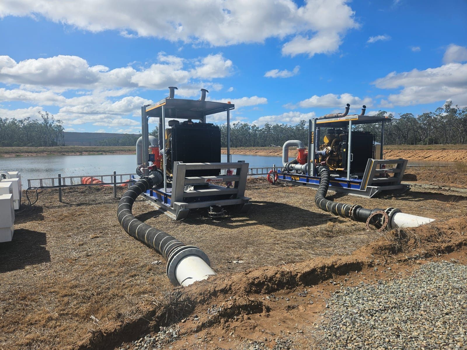 Industrial Water Pumping Equipment With Large Black Hoses — Forcequip In Moranbah, QLD