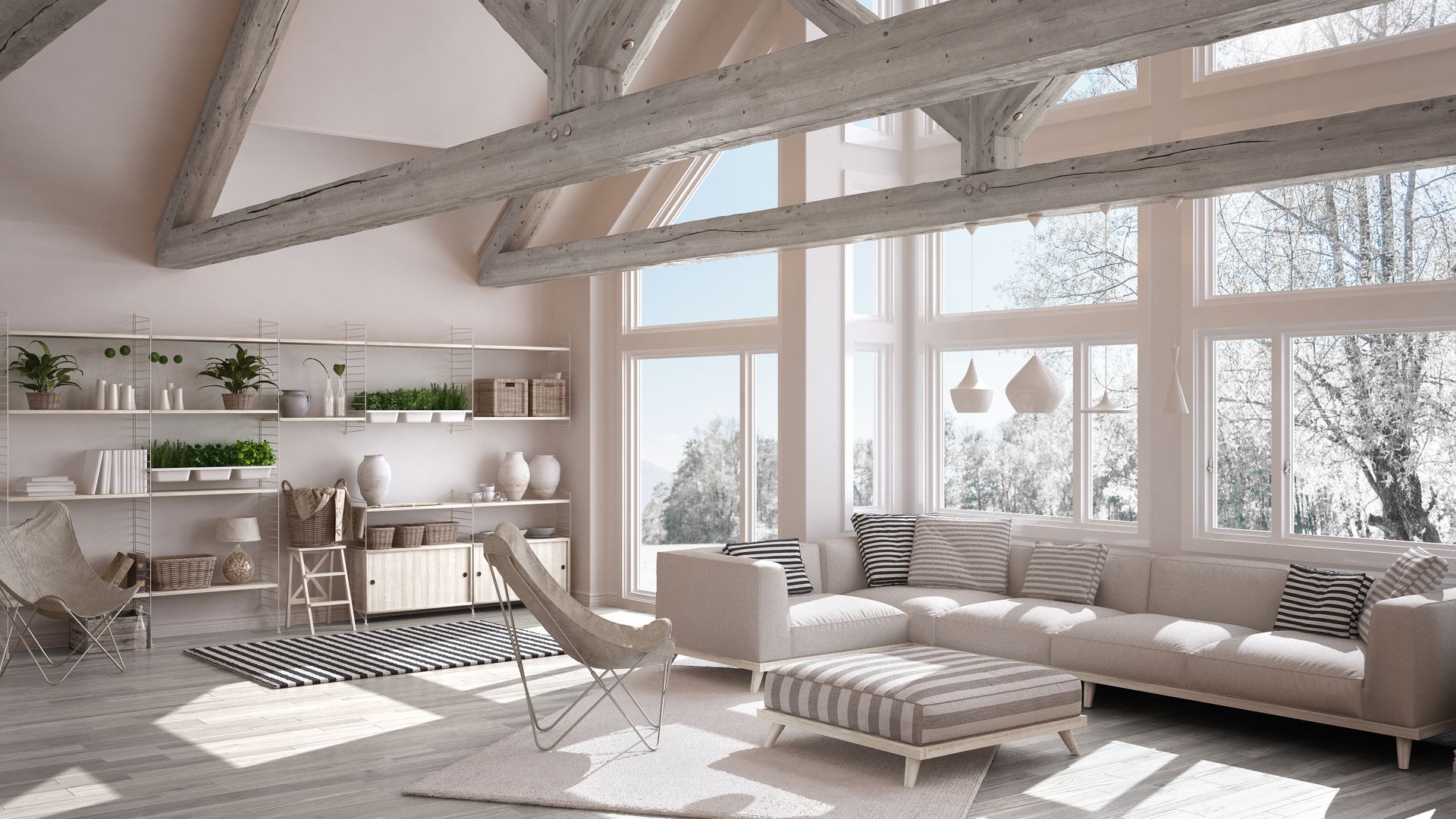 It is a living room with a lot of windows and a couch.