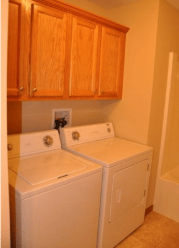 A laundry room with a washer and dryer in it