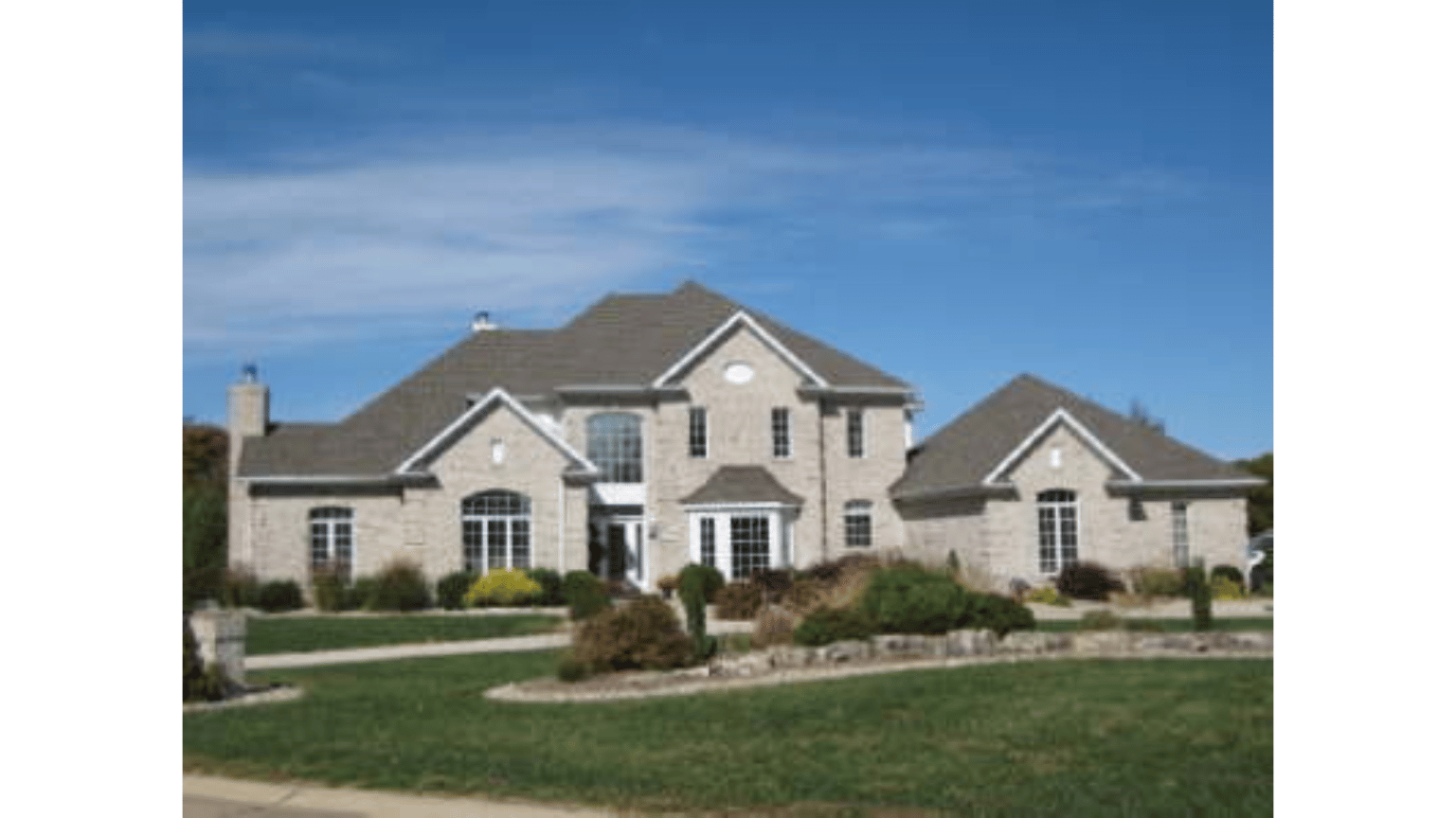 A large brick house with a gray roof