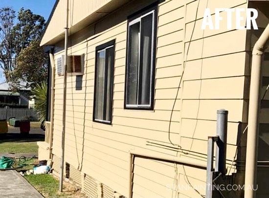 Exterior of A House with Beige Siding, Black-Framed Windows — Stan Painting Services In Newcastle, NSW