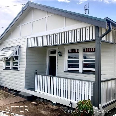 Newly painted white house with dark gray trim — Stan Painting Services In Thornton, NSW