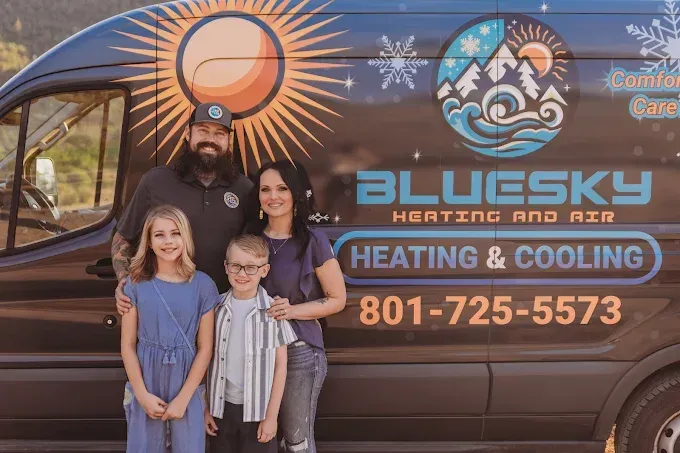 Family posing by a BlueSky Heating and Cooling service van with company logo and phone number.