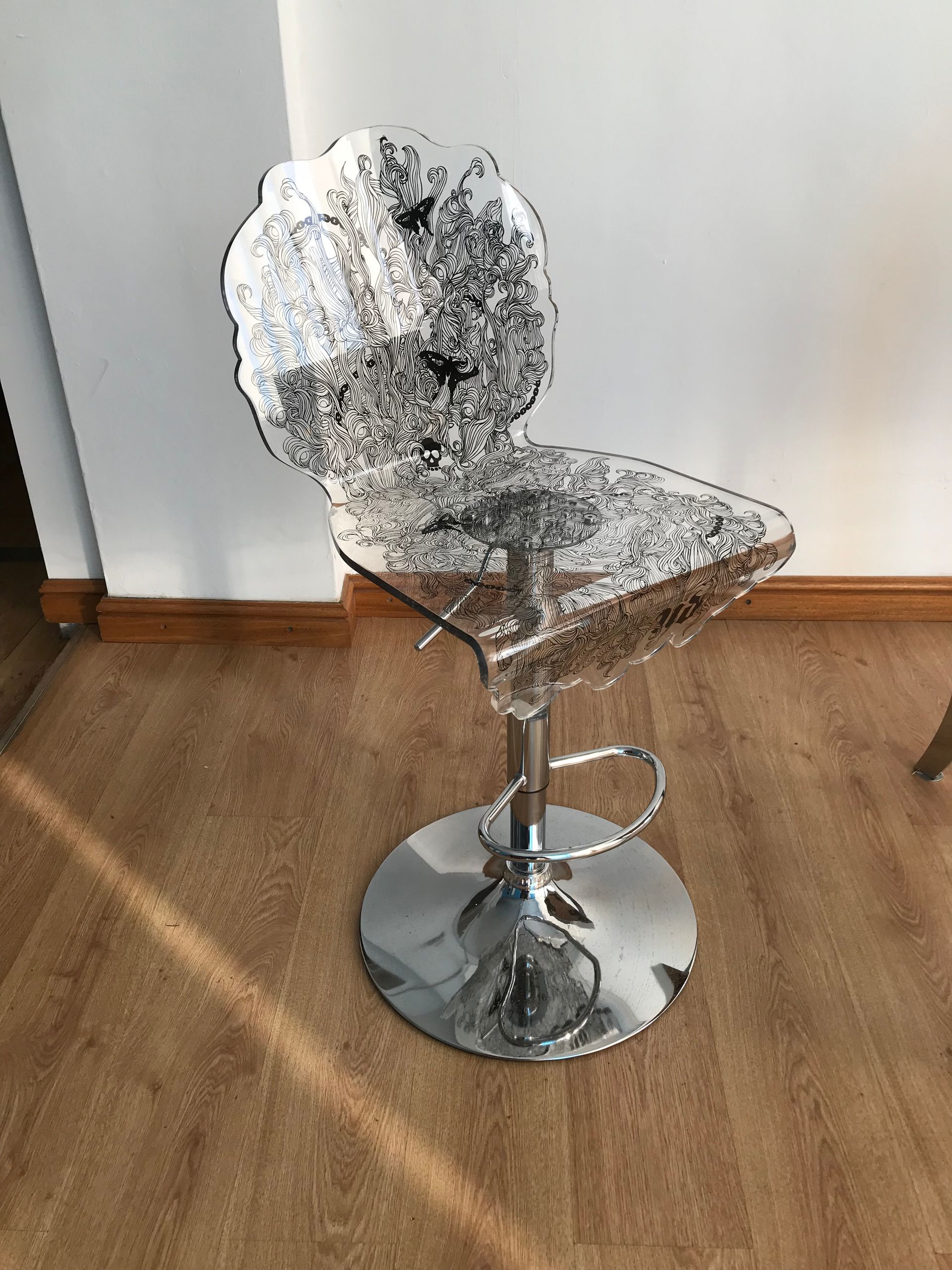 Acrylic heat formed chair with direct printed floral black outline design