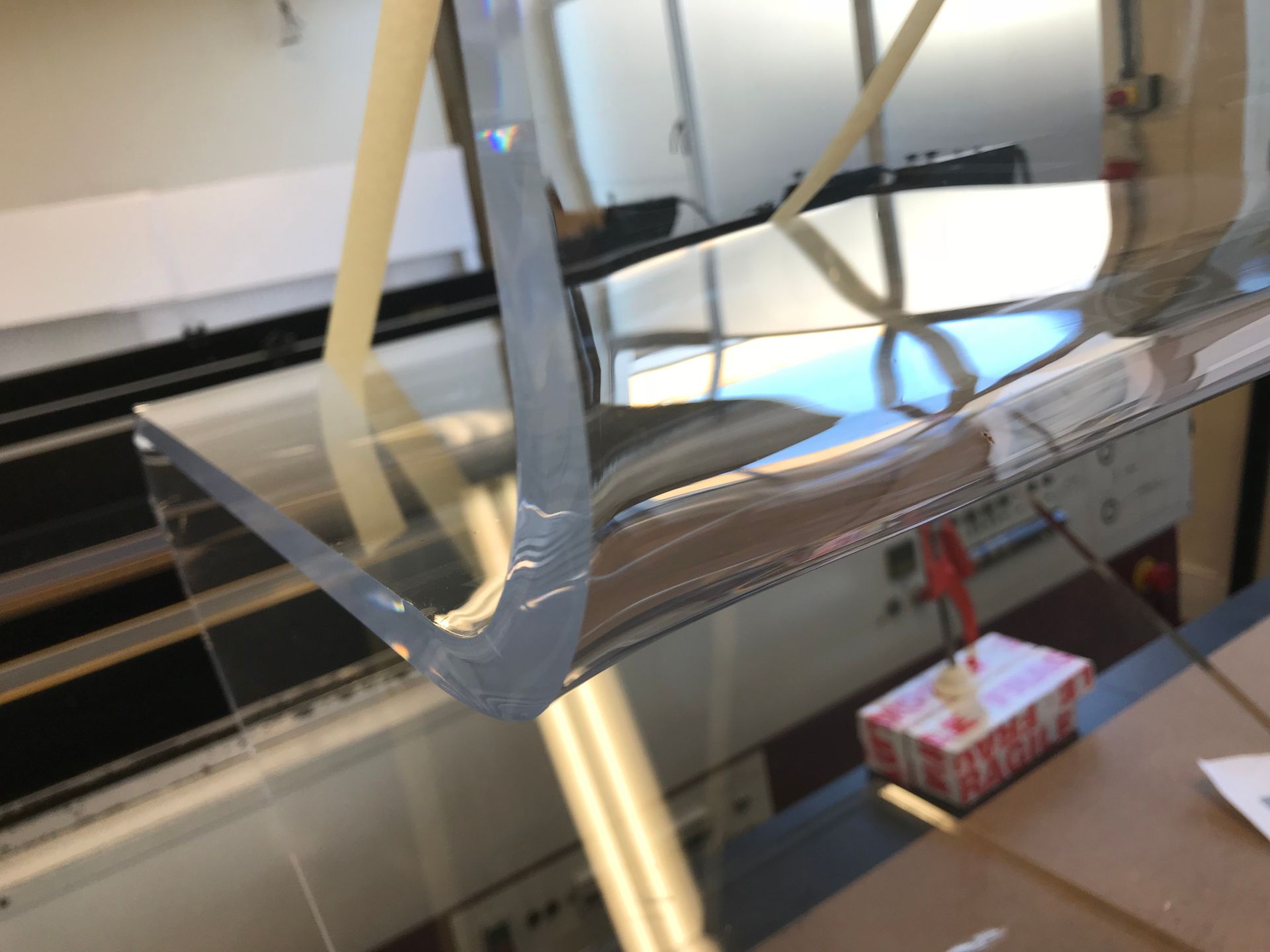 Another view of heat formed from chair in clear acrylic close up of polished edges