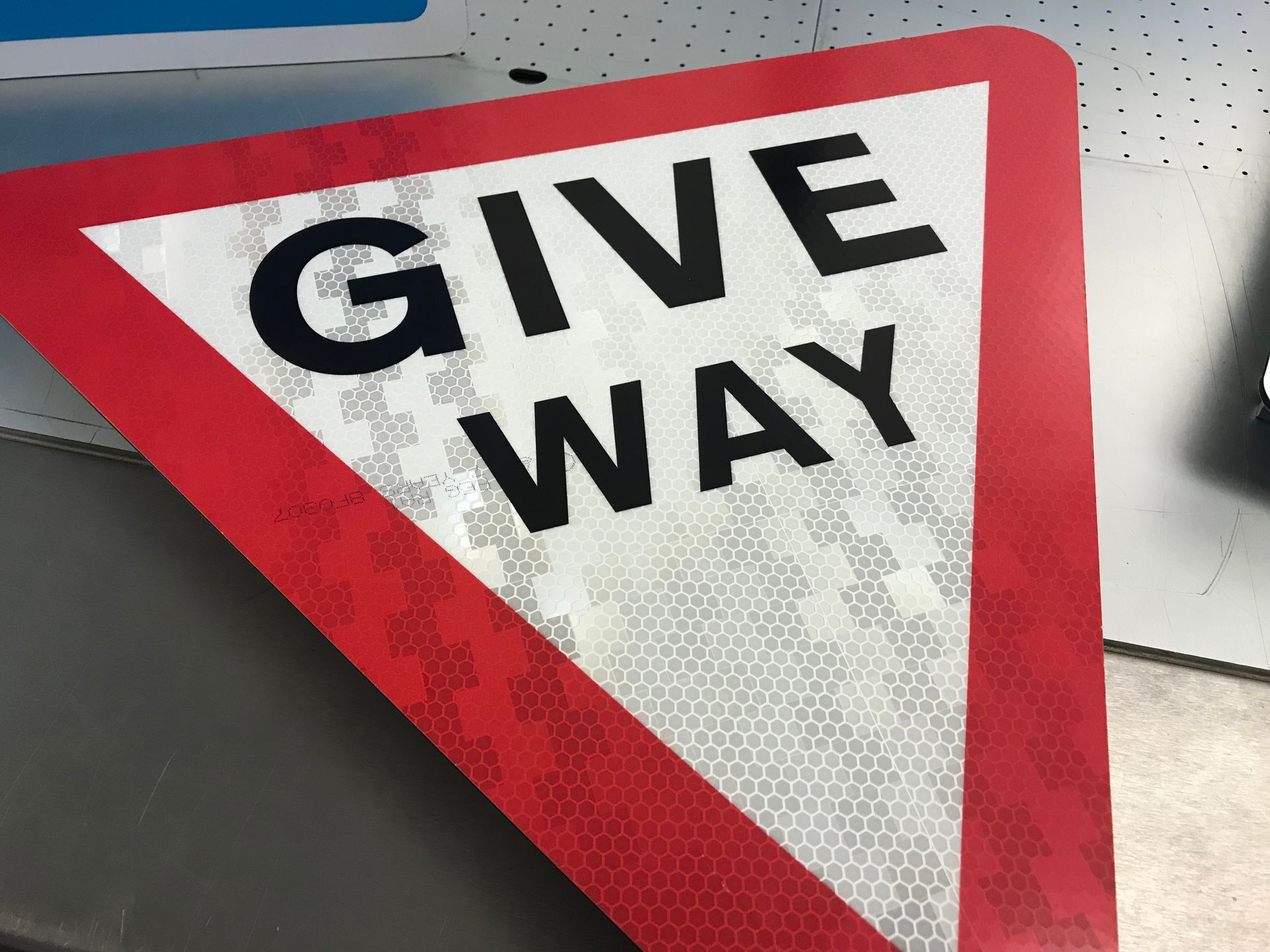 Printed Give way road sign on reflective diabone