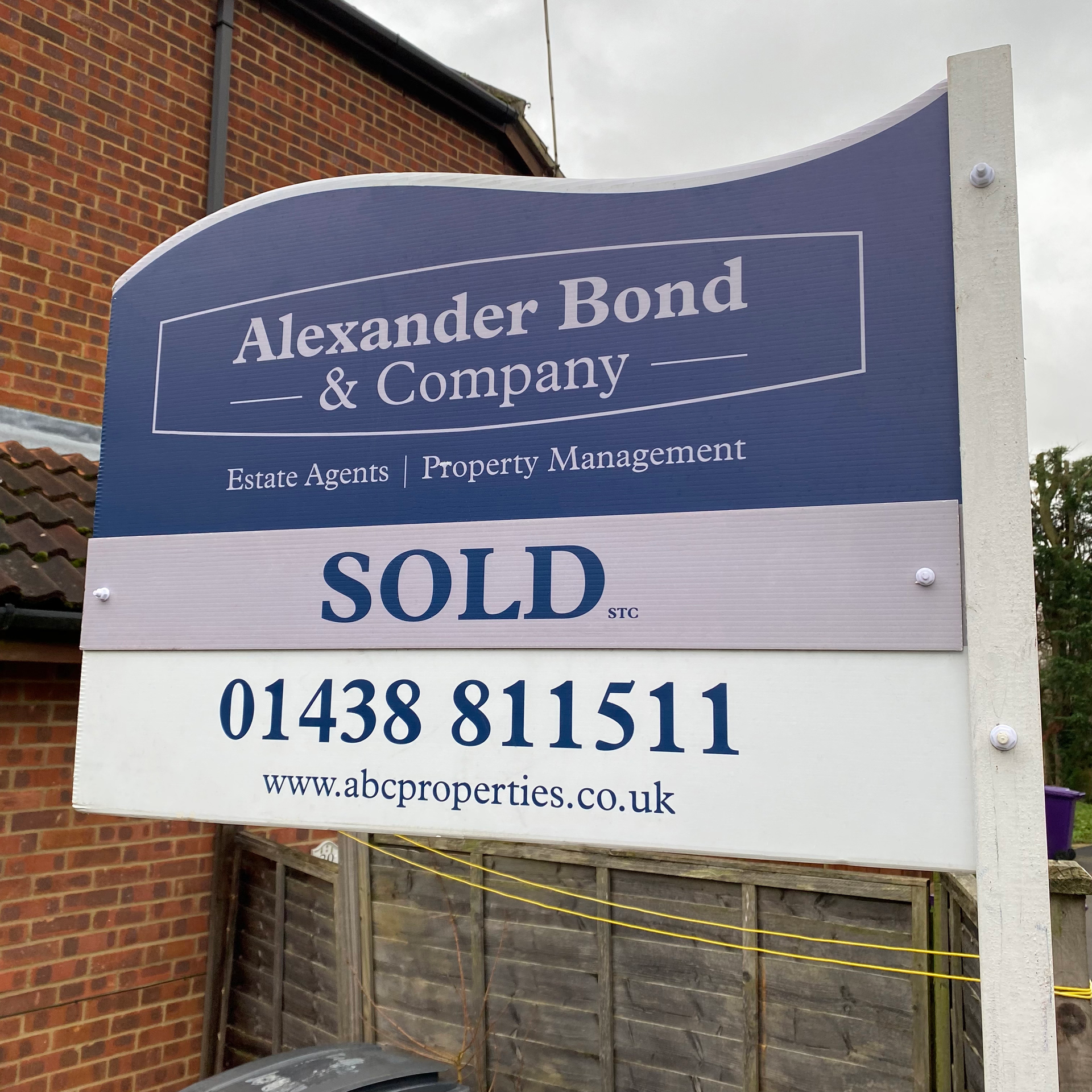 wavy shaped for sale signs for Alexander Bond & Company