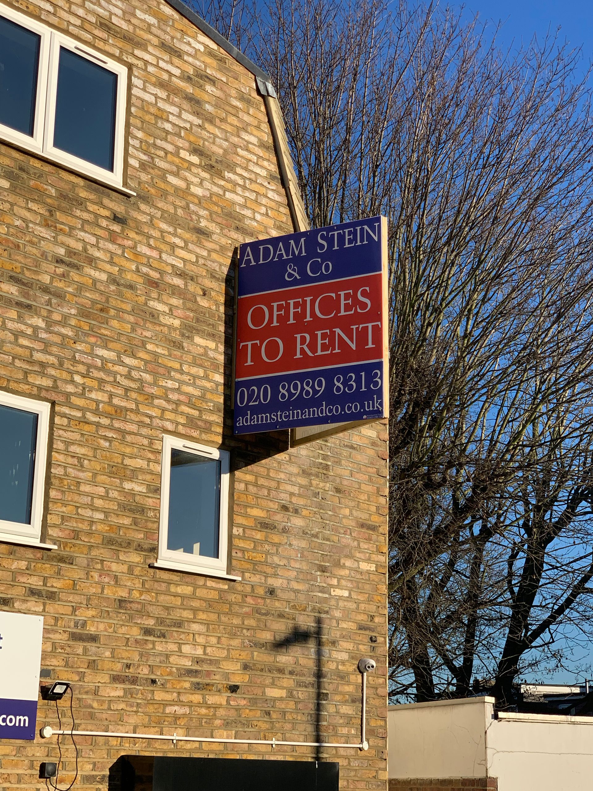 Wall mounted building v-board for Adam Stein estate agents