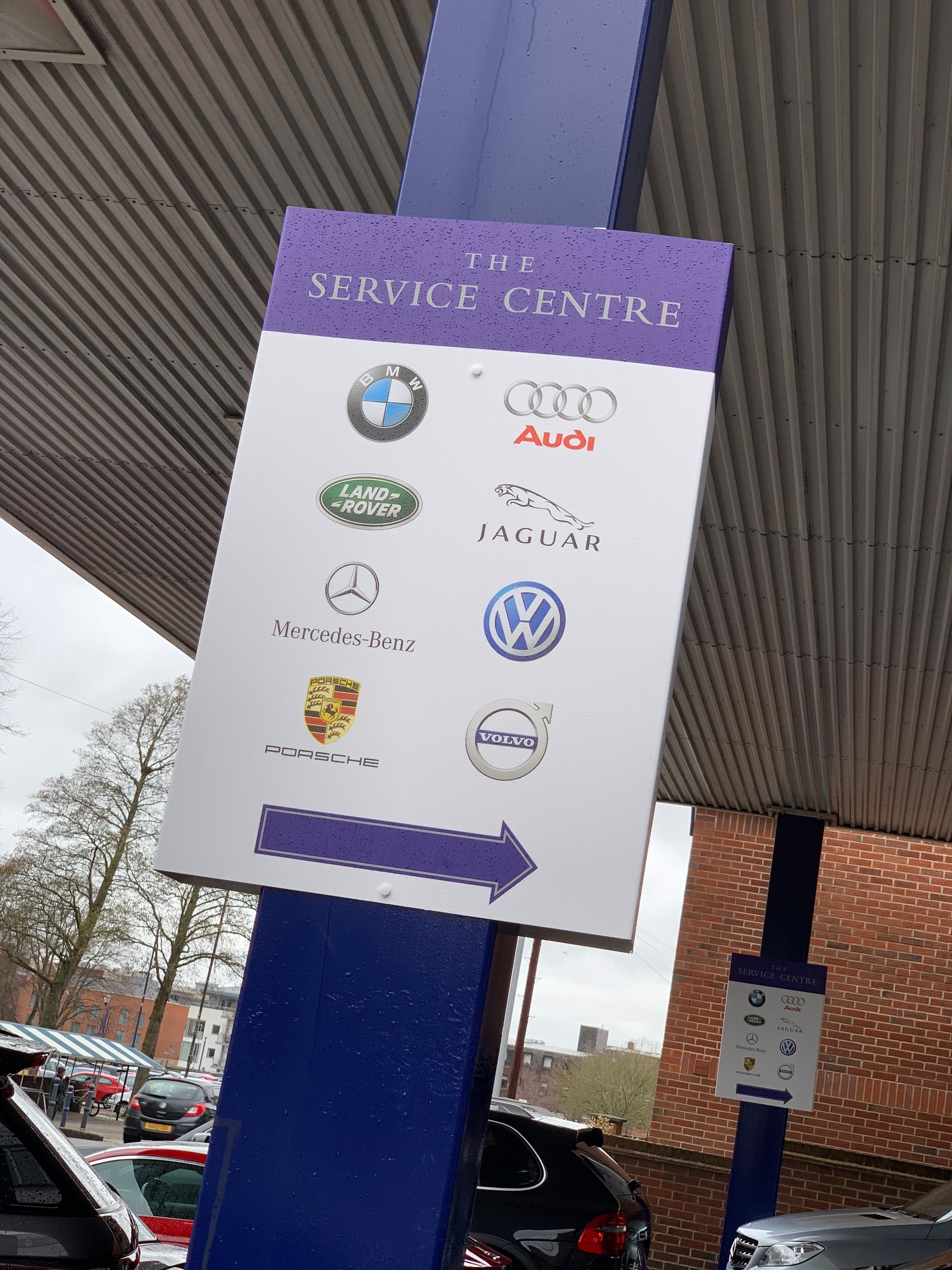 printed post mounted 'service centre' sign