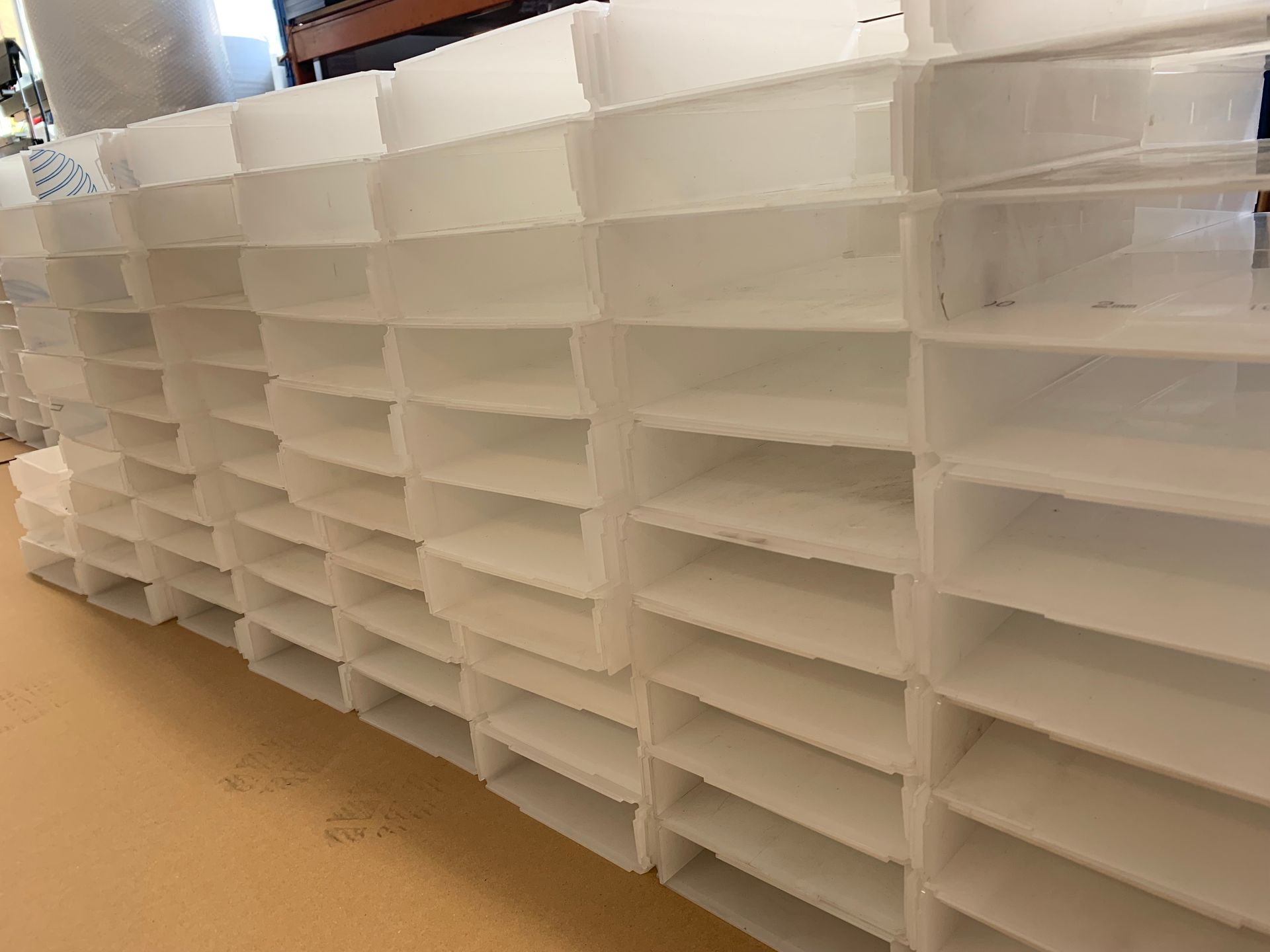 stacks of leaflet pockets moulded and heat formed from acrylic sheets