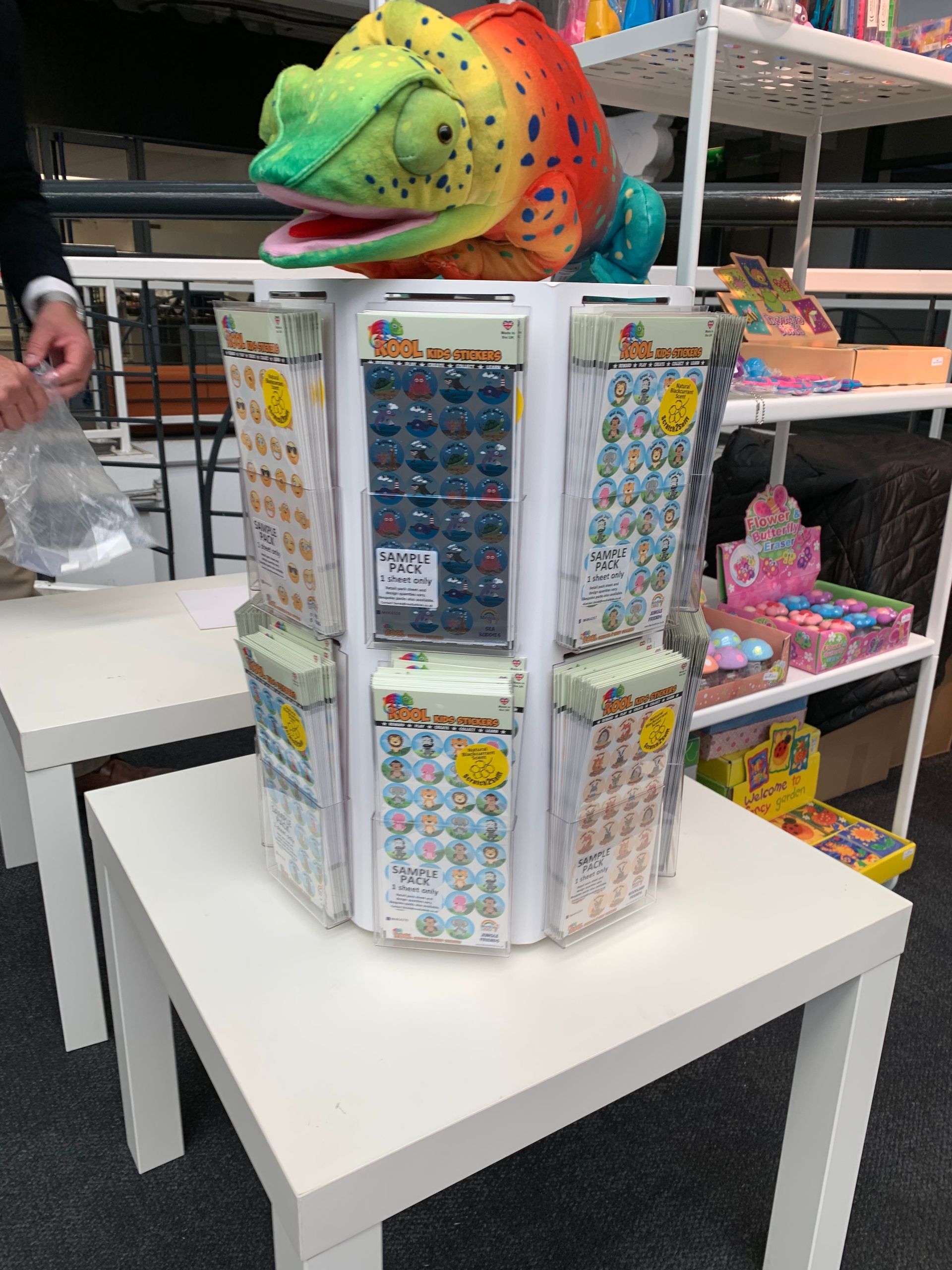 Rotating point of sale sticker dispenser in use