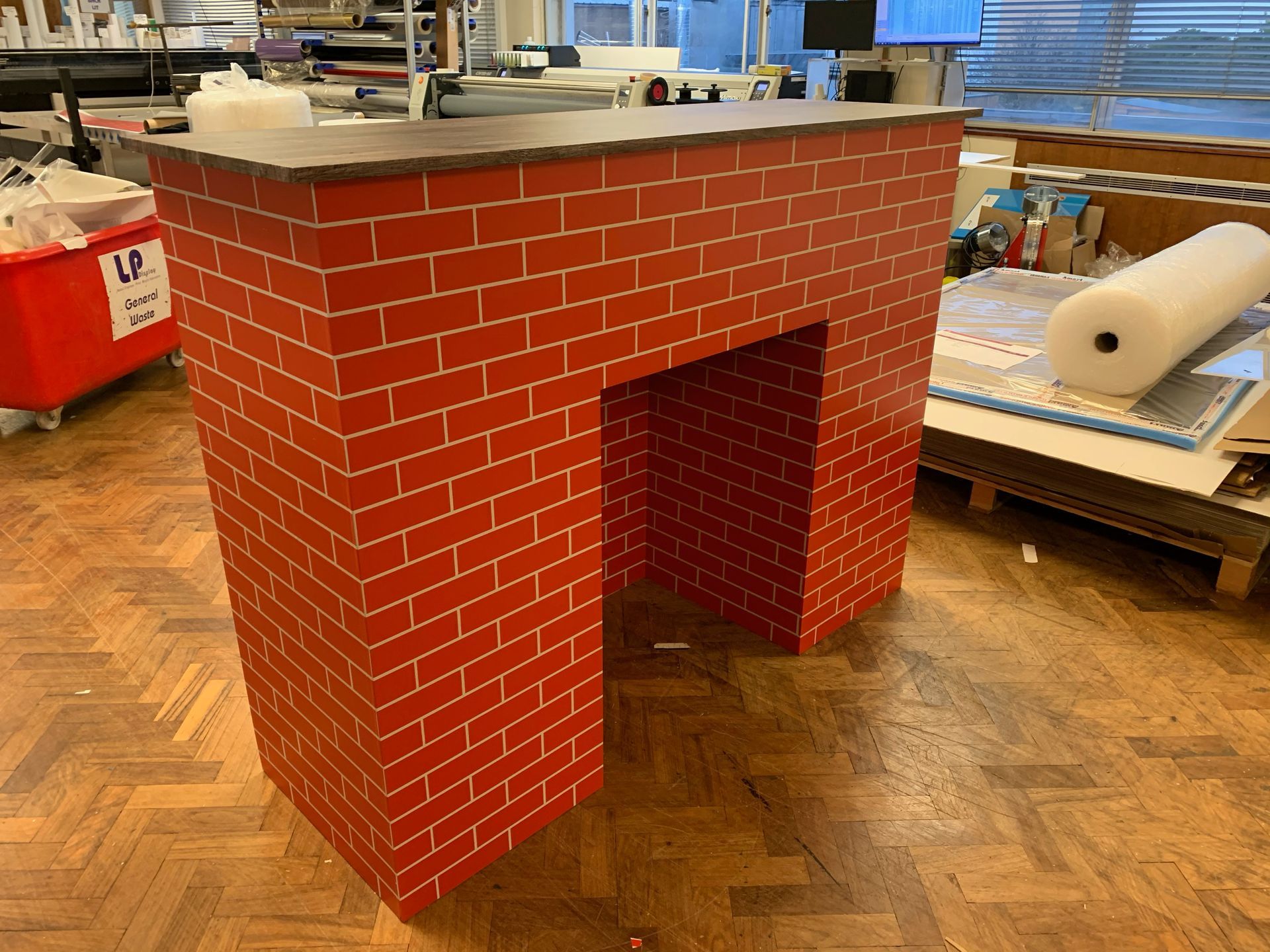 Mock fire place Exhibition Counter manufactured with printed brick panels