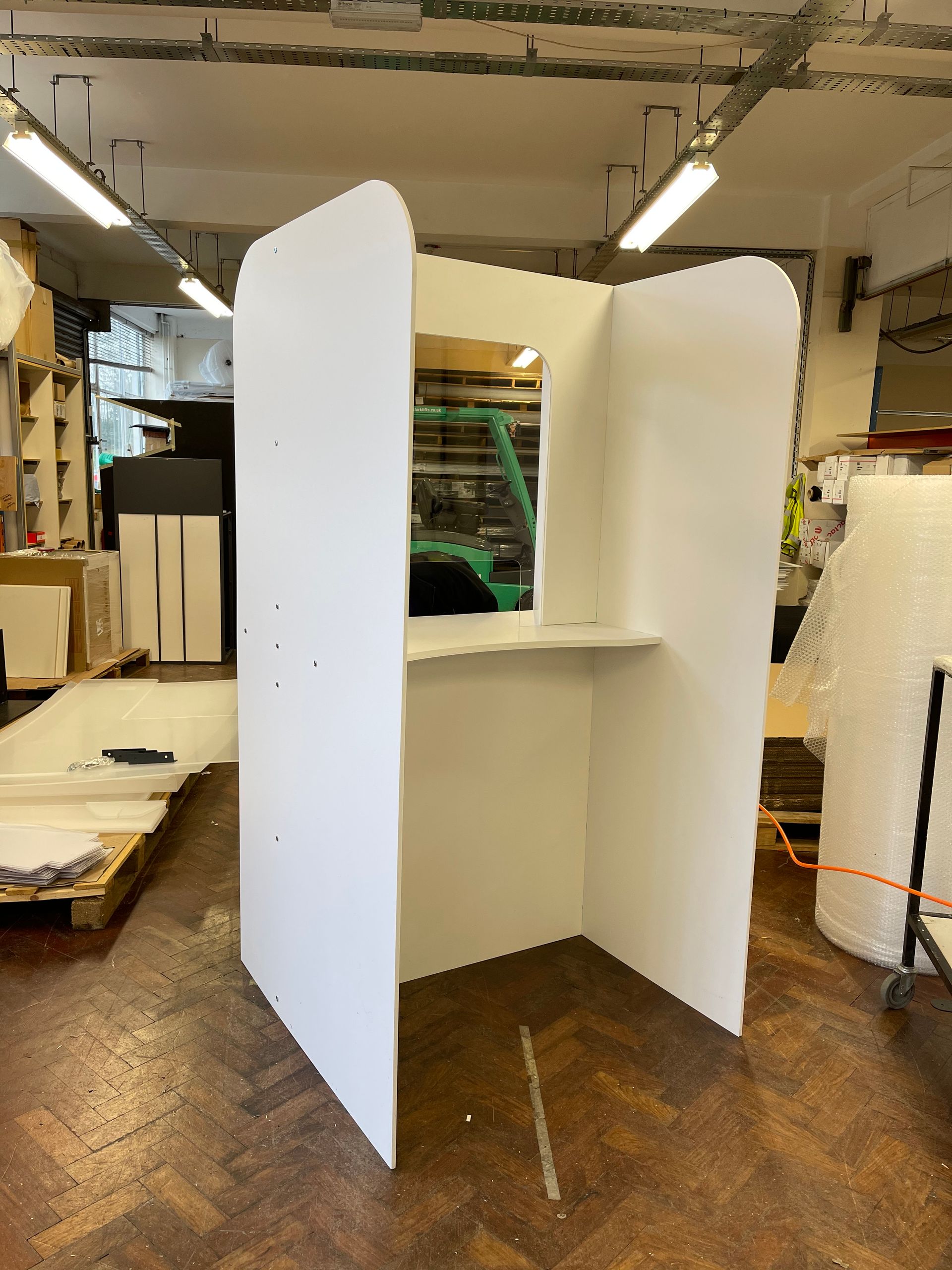 Free standing booth manufactured from foamex boards with perspex counter window and shelf