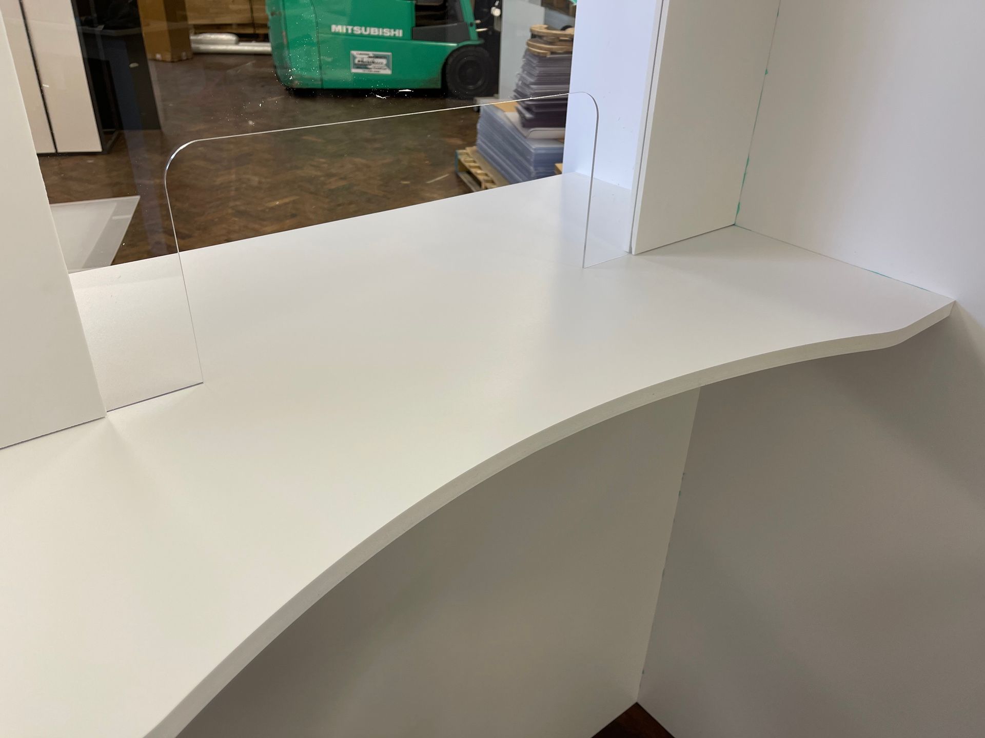 Close up of booth perspex counter window and shelf