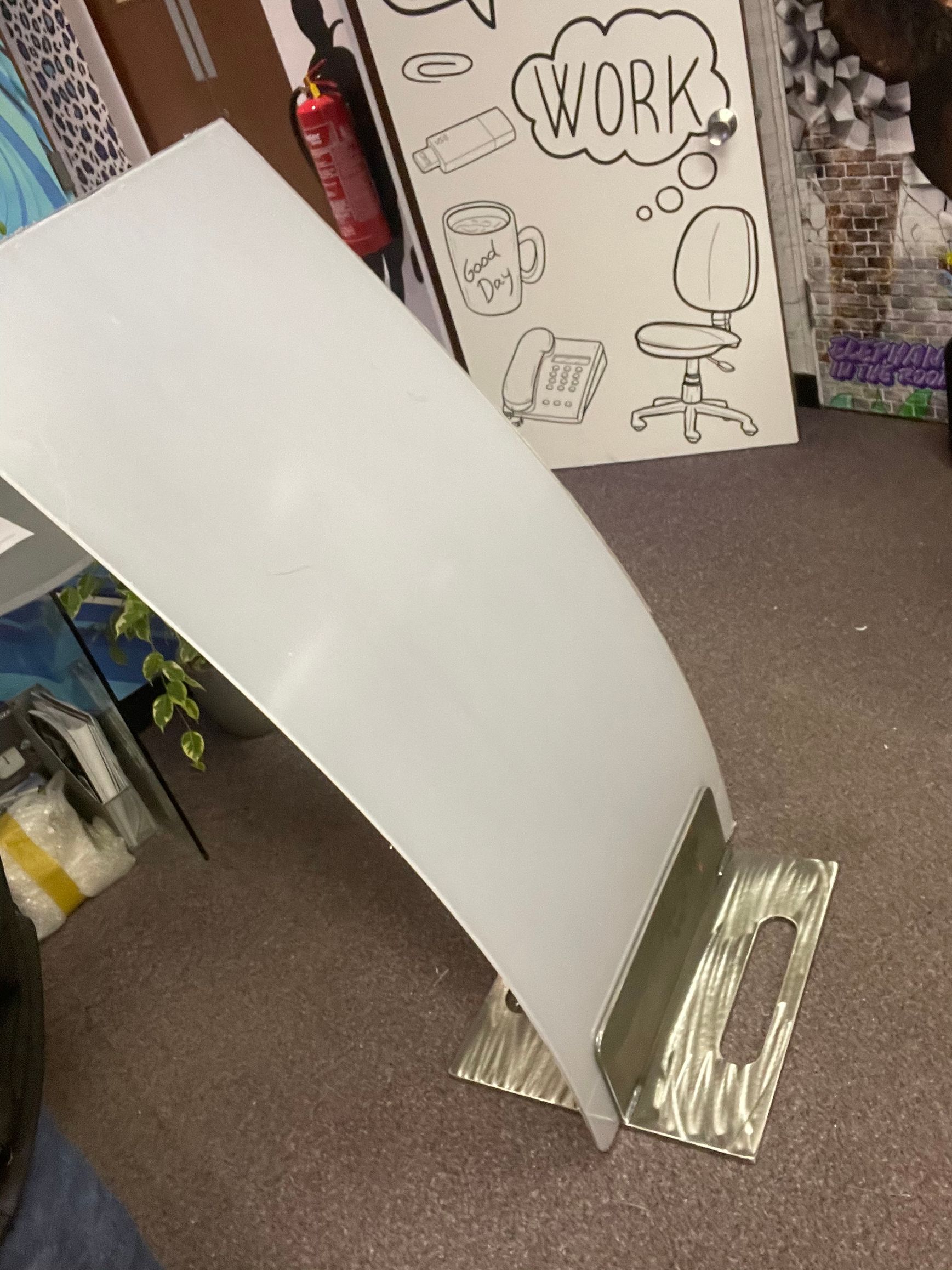 Sheet metal fabricated floor sign stand in use