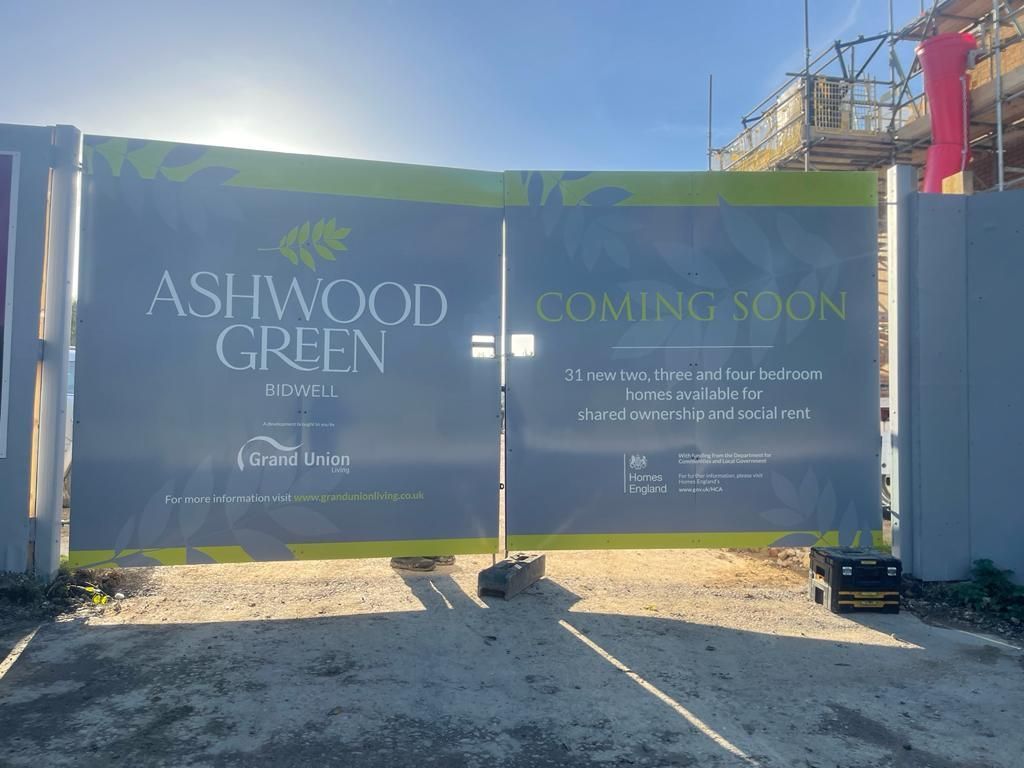 More printed construction site perimeter gate hoarding panels with advertising and branding space for the Ash Green development by Grand Union