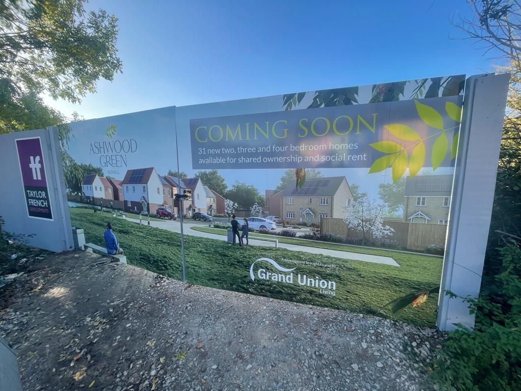 Printed construction site perimeter gate hoarding panels with advertising and branding space for the Ash Green development by Grand Union