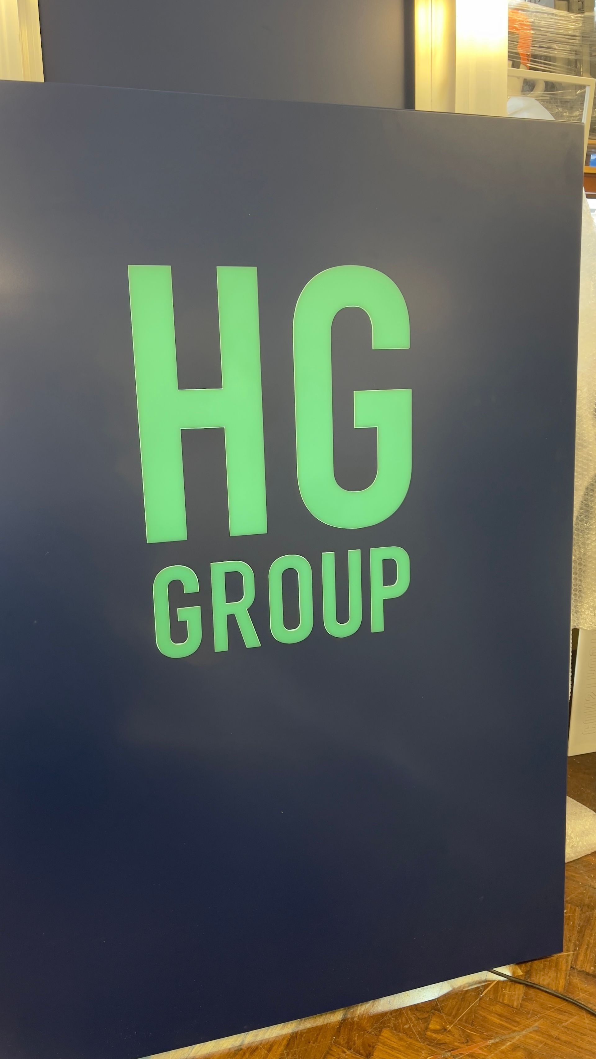 Internal illuminated entrance sign for the HG Group 