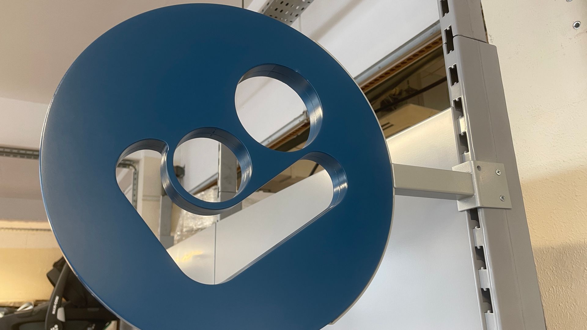 Manufacture of Maxi-cosi logo in metal for shop racking