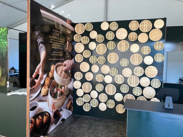 Exhibition wall graphics covered with bamboo steamers