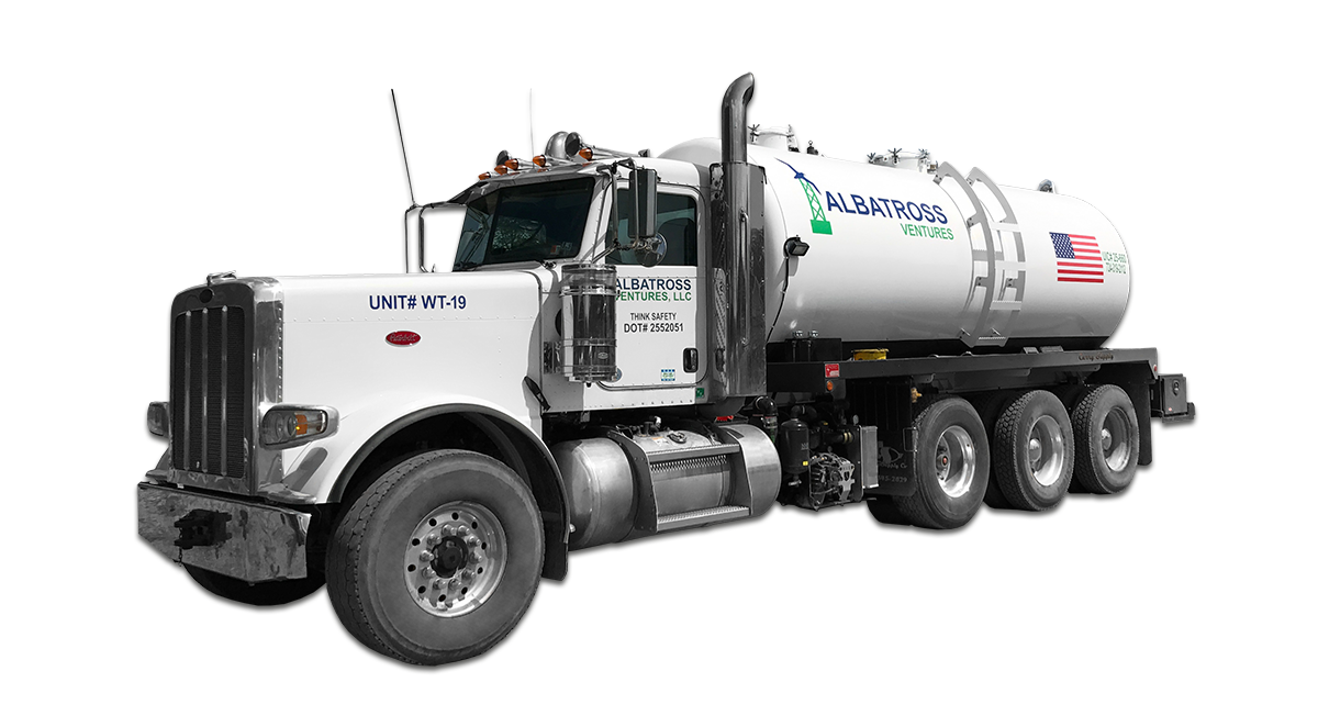 A white vacuum truck with an american flag on the side is on a white background. A white vacuum truck with an american flag on the side is on a white background.