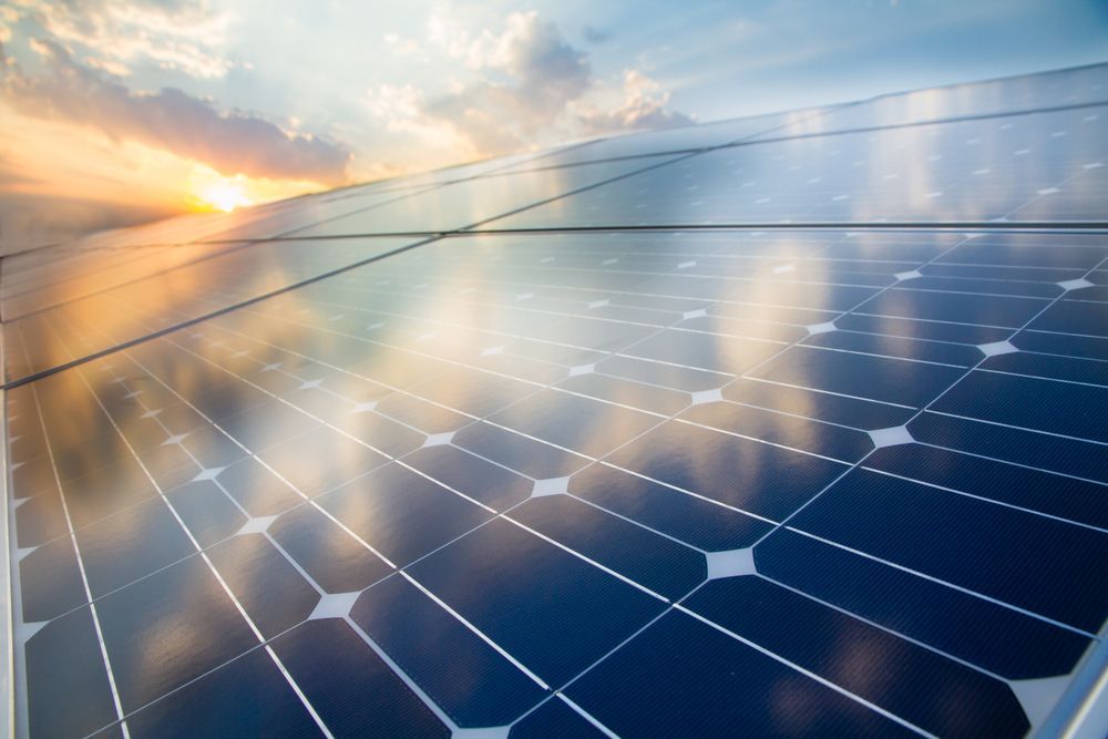 Solar Panels Reflecting a Cloudy Sky and Sunset — SOLARCO Central West in Orange, NSW