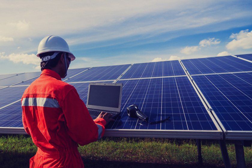 Worker Checking Solar Panel — SOLARCO Central West in Forbes, NSW