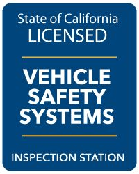 California licensed vehicle safety systems inspection station sign, blue background with white text.