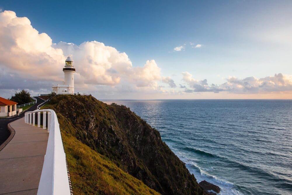 A Lighthouse On Top Of A Cliff Overlooking The Ocean — Ballina Painting Service In Byron Bay, NSW