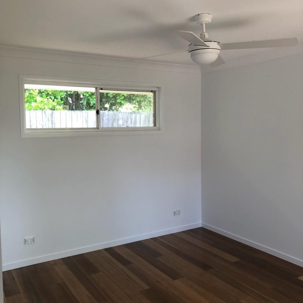 An Empty Room With A Ceiling Fan And A Window — Ballina Painting Service In Ballina, NSW