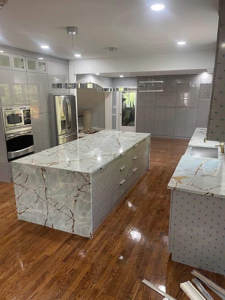 There is a large island in the middle of the kitchen.