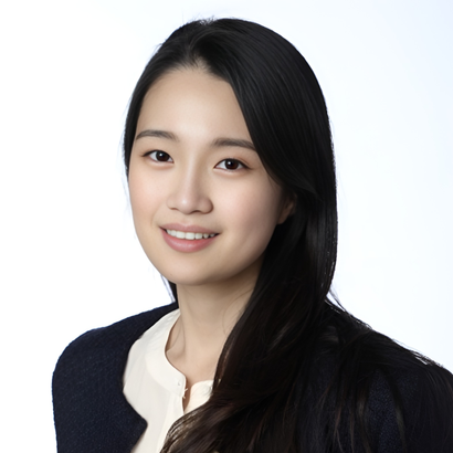 Smiling woman with long black hair in a white blouse and dark jacket on a white background